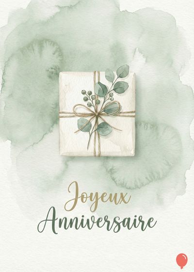 Un cadeau rectangulaire ficelé, orné de feuillage vert pâle, sur un aplat vert aquarelle. En dessous, lettrage cursif « Joyeux Anniversaire » en or et vert olive. Ballons rouges.